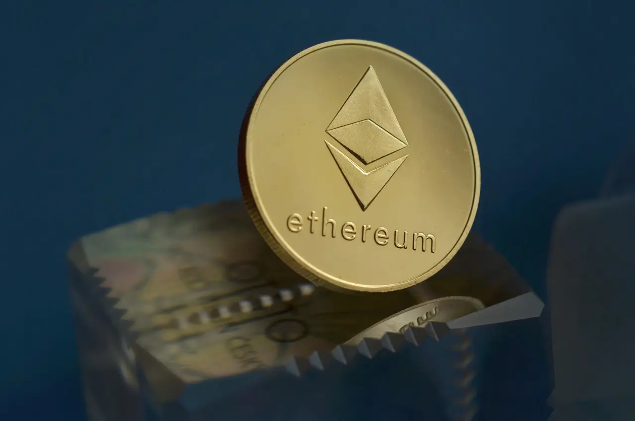 A close-up of a gold Ethereum coin with a holographic image in the center.