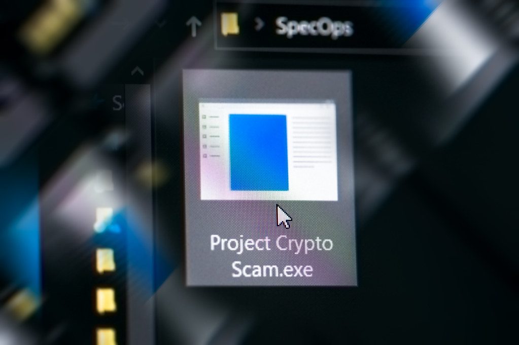 Mouse cursor about to double-click and run 'Project Crypto Scam' executable.